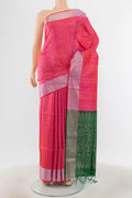 Mint Green Soft Silk Saree with Zari Butta on the body and Silk Border.  displayed on a mannequin