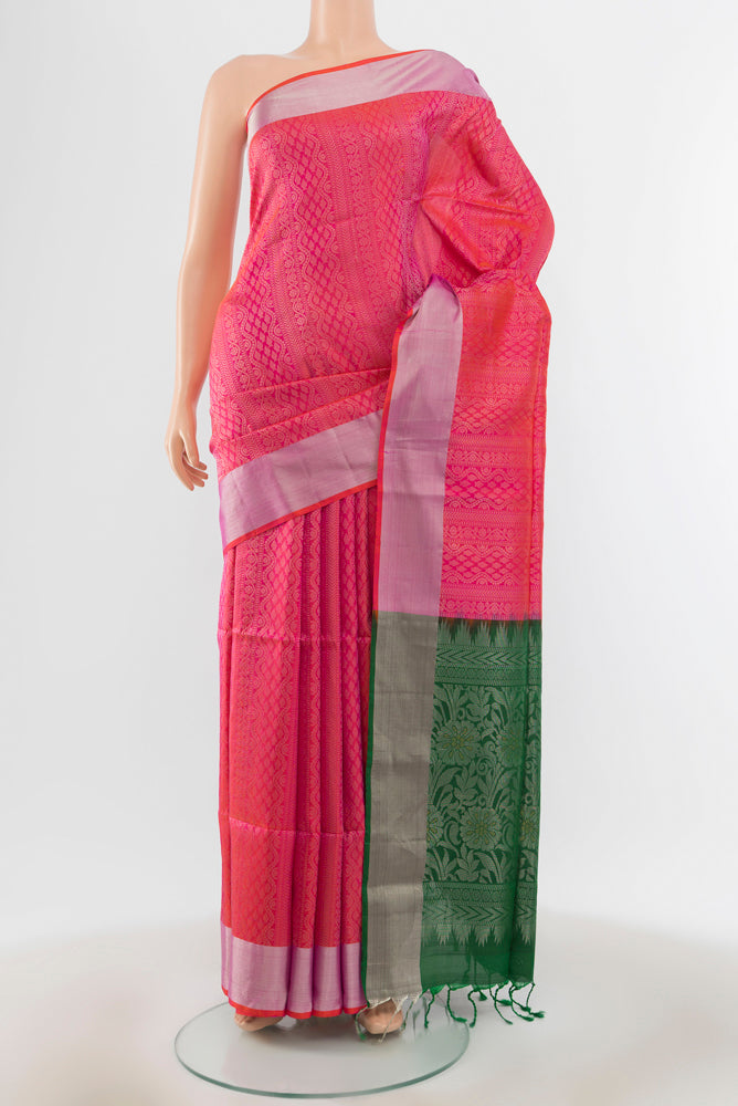 Mint Green Soft Silk Saree with Zari Butta on the body and Silk Border.  displayed on a mannequin