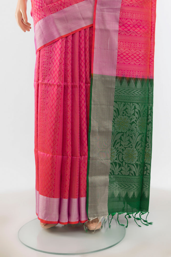 Pleats and pallu of Mint Green Soft Silk Saree with Zari Butta on the body and Silk Border. 