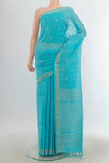 Light Blue Soft Saree with Zari Butta on the body and Silk Border.  displayed on a mannequin