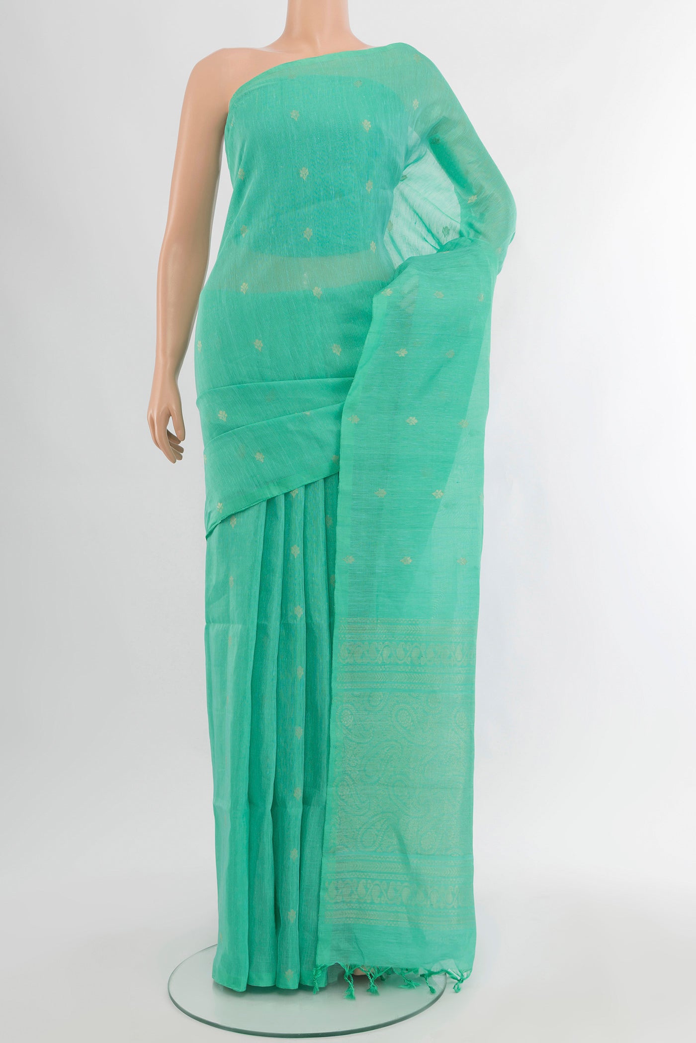 Sky Blue Soft Silk Saree with Zari Butta on the body and Silk Border.  displayed on a mannequin
