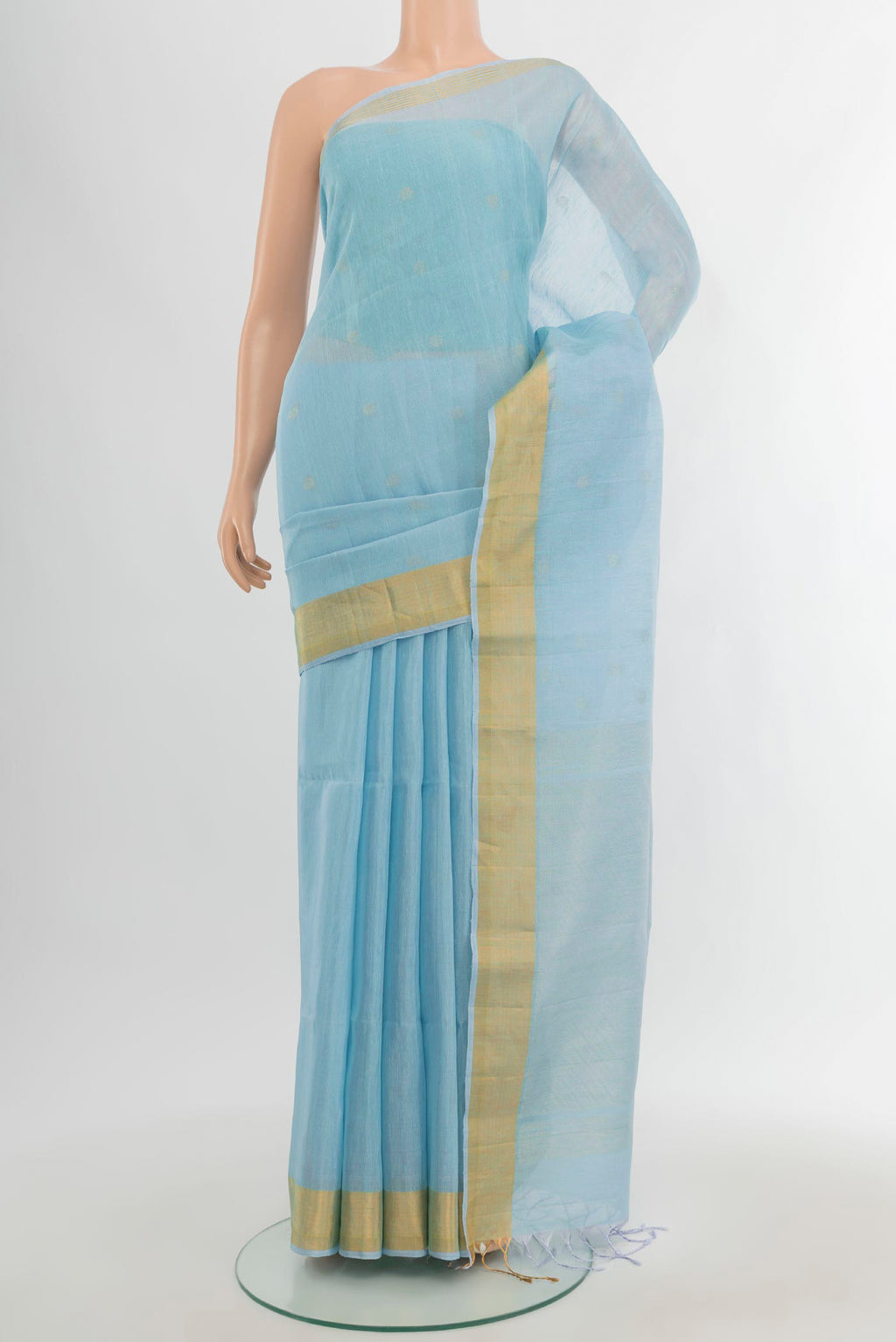 Sky Blue Soft Silk Saree with Zari Butta on the body and Zari Border.  displayed on a mannequin