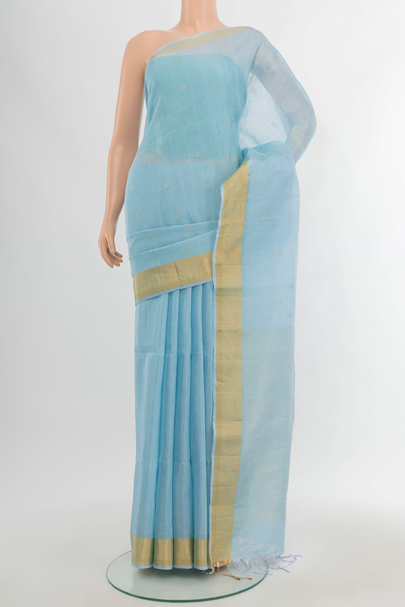 Sky Blue Soft Silk Saree with Zari Butta on the body and Zari Border.  displayed on a mannequin