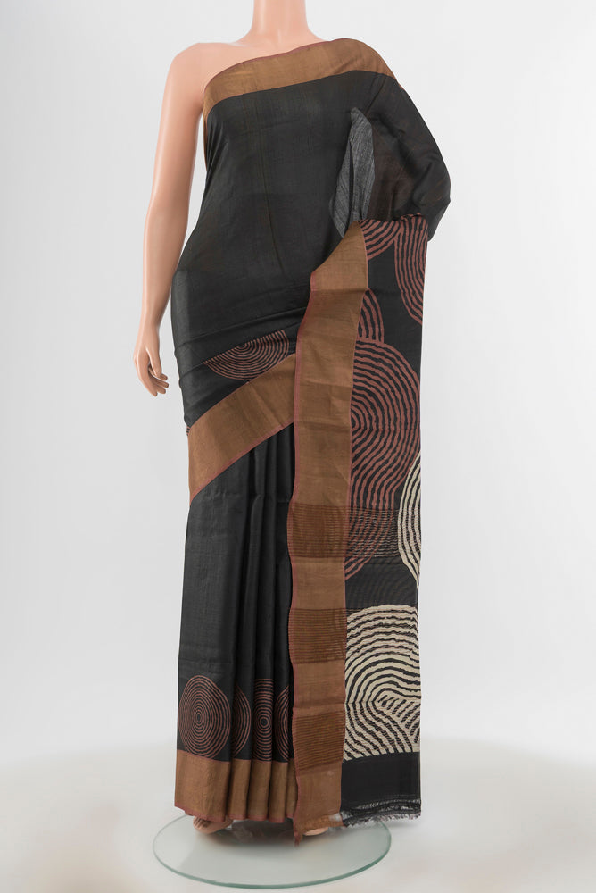 Pure Silk Pure Zari Multi Color Tussar Saree with Floral Print on the body and Silk Border.  displayed on a mannequin