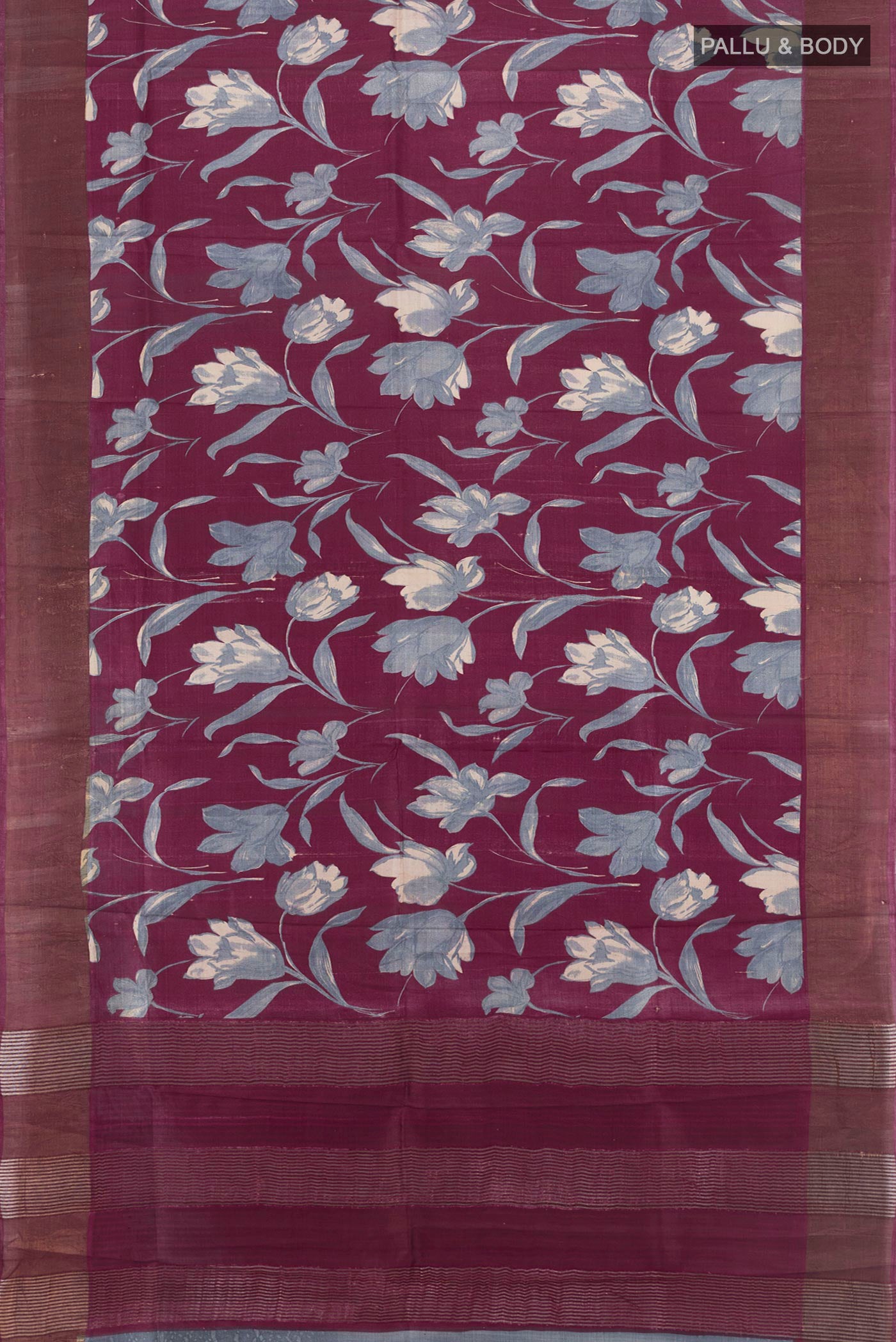 Flat view of Burgundy Tussar Silk Saree with Floral Print on the body and Zari Border. 