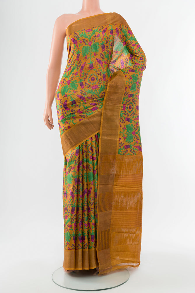 Pure Silk Pure Zari Multi Color Tussar Saree with Floral Print on the body and Silk Border.  displayed on a mannequin