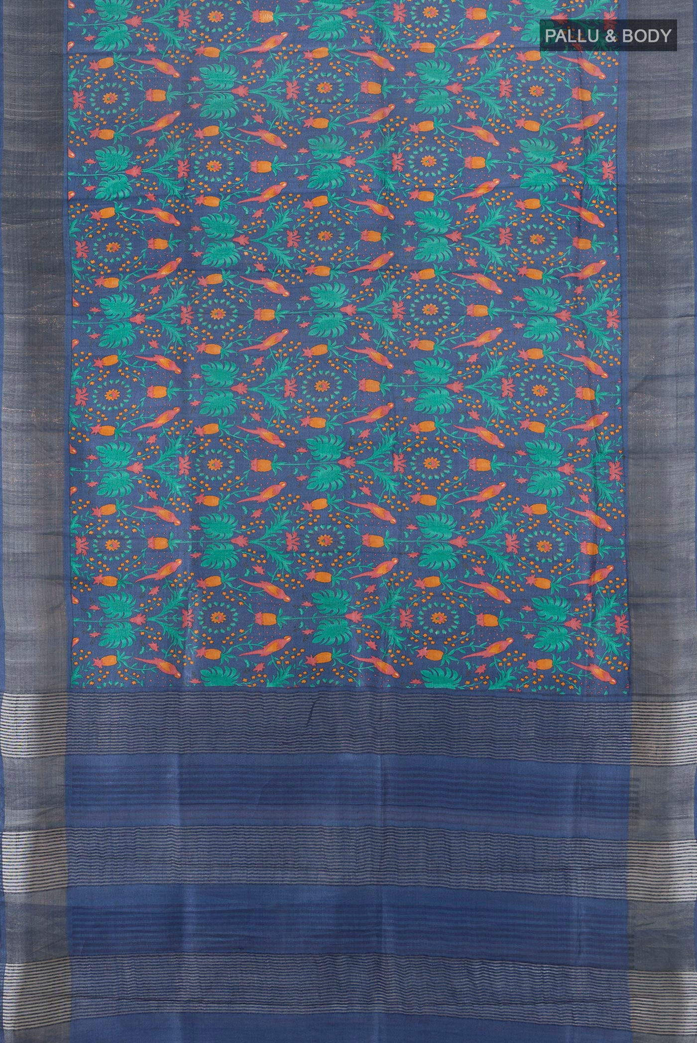 Flat view of Blue Tussar Silk Saree with Floral Print on the body and Zari Border. 