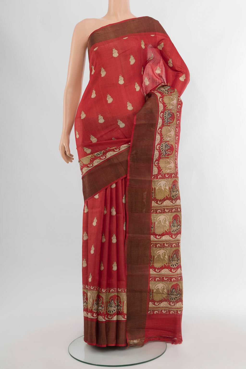 Red Tussar Silk Saree with Floral Print on the body and Zari Border.  displayed on a mannequin