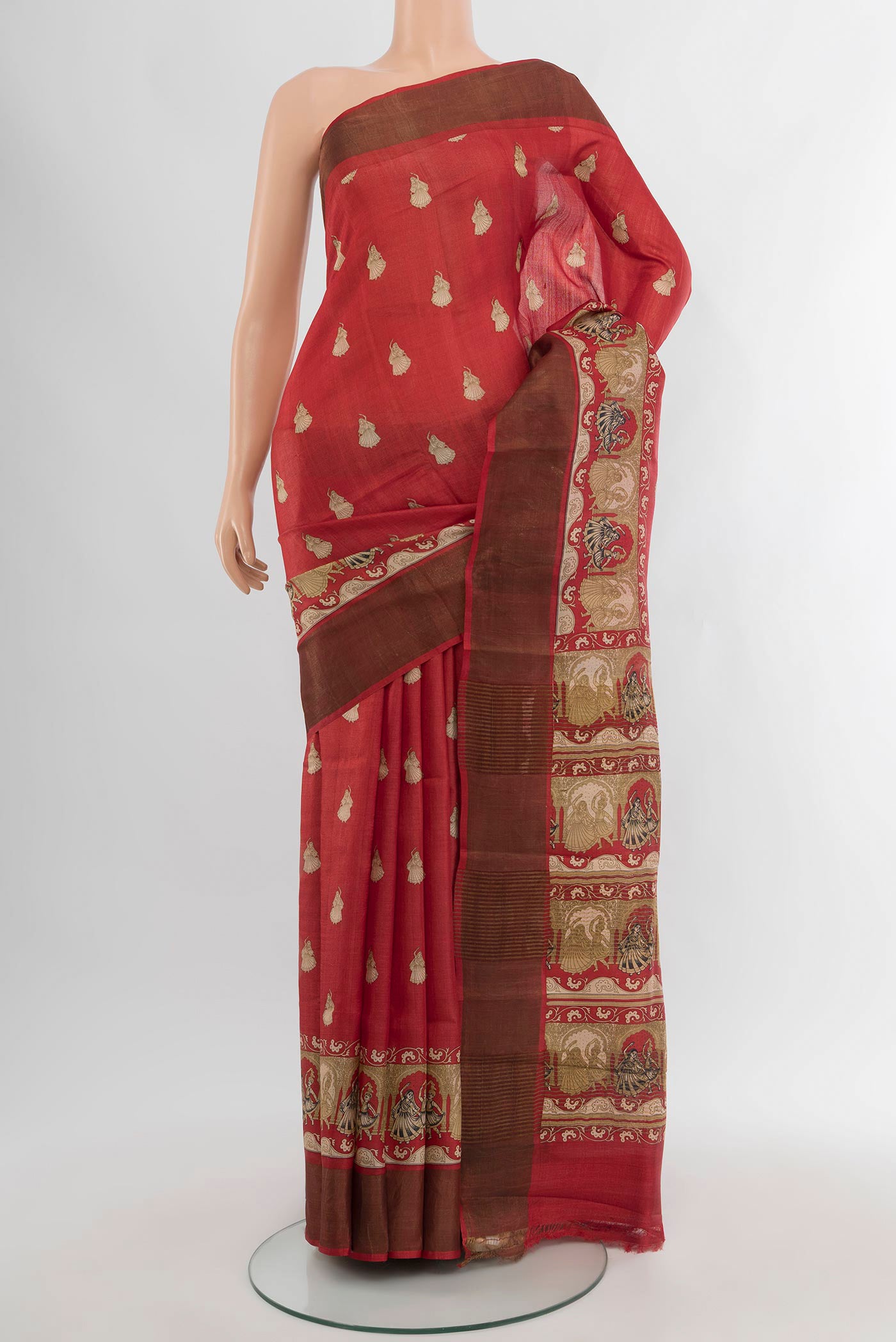 Red Tussar Silk Saree with Floral Print on the body and Zari Border.  displayed on a mannequin