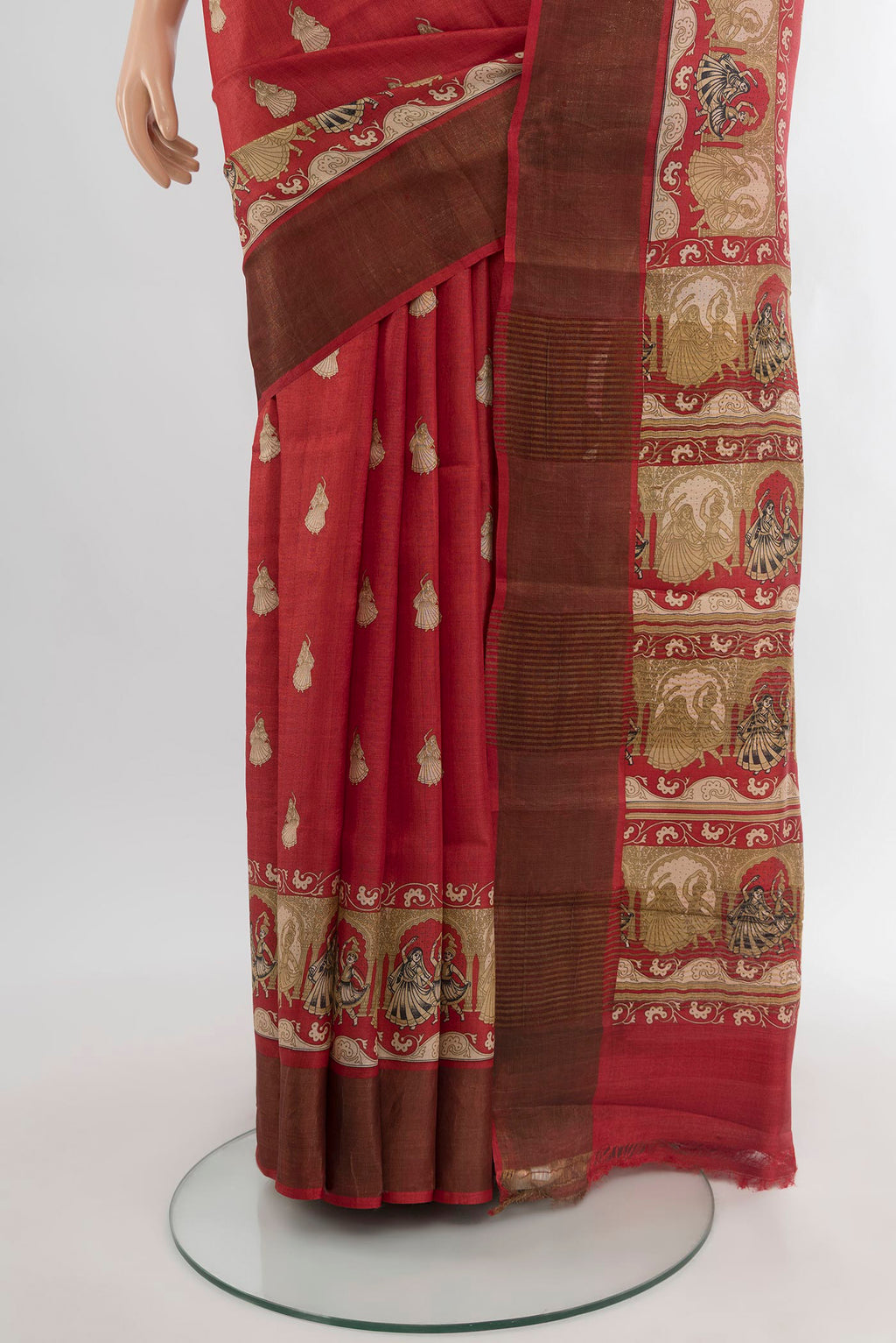 Pleats and pallu of Red Tussar Silk Saree with Floral Print on the body and Zari Border. 