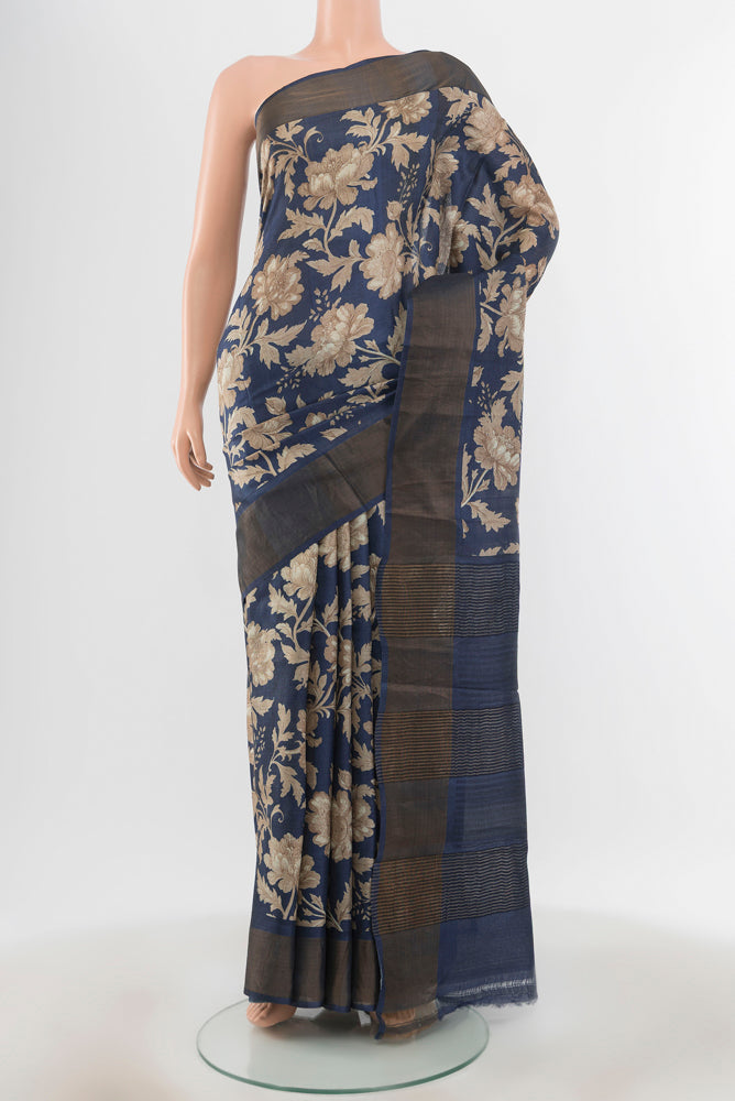 Pure Silk Pure Zari Multi Color Tussar Saree with Floral Print on the body and Silk Border.  displayed on a mannequin