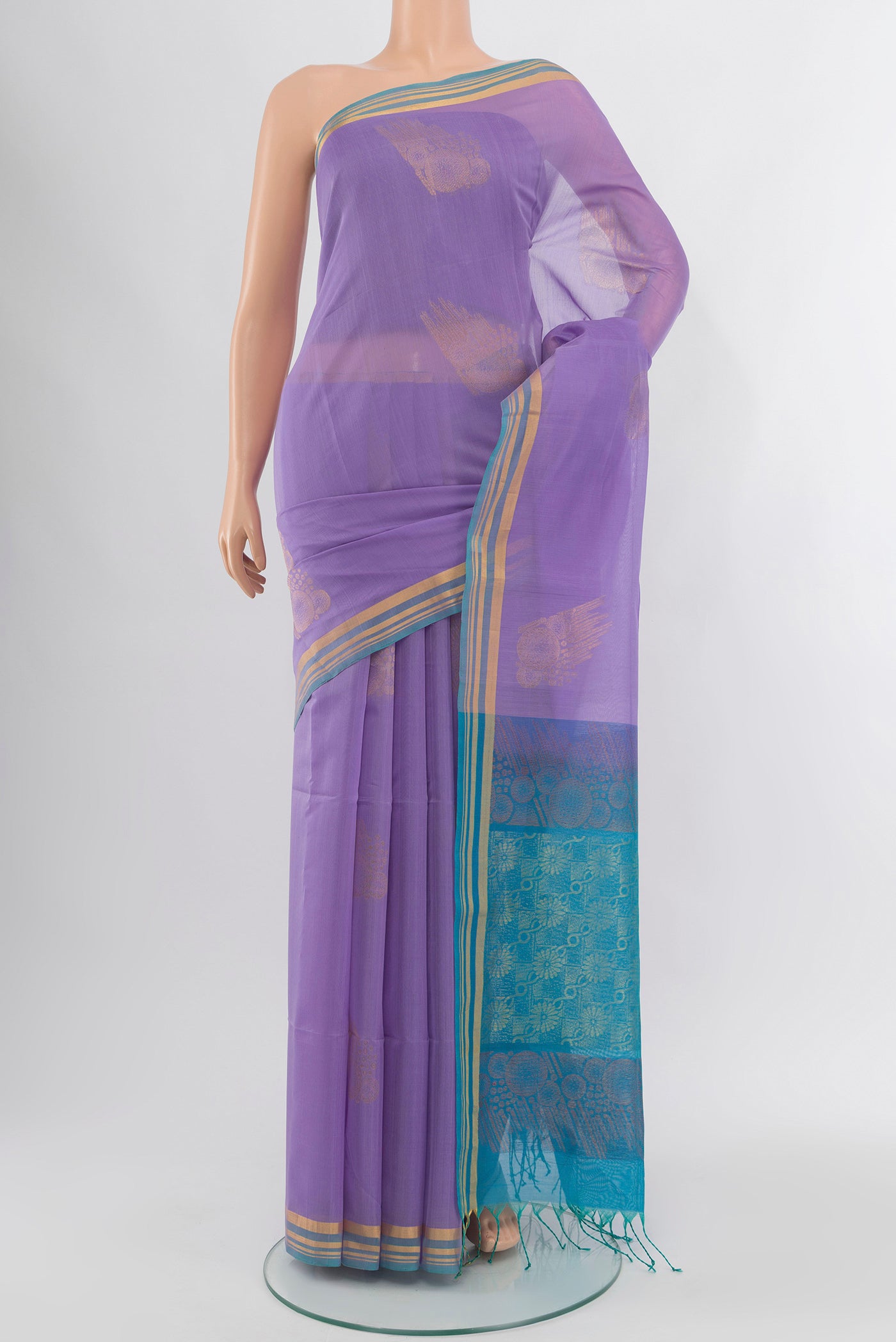 Lavender Silk Cotton Saree with Zari Butta on the body and Zari Border.  displayed on a mannequin