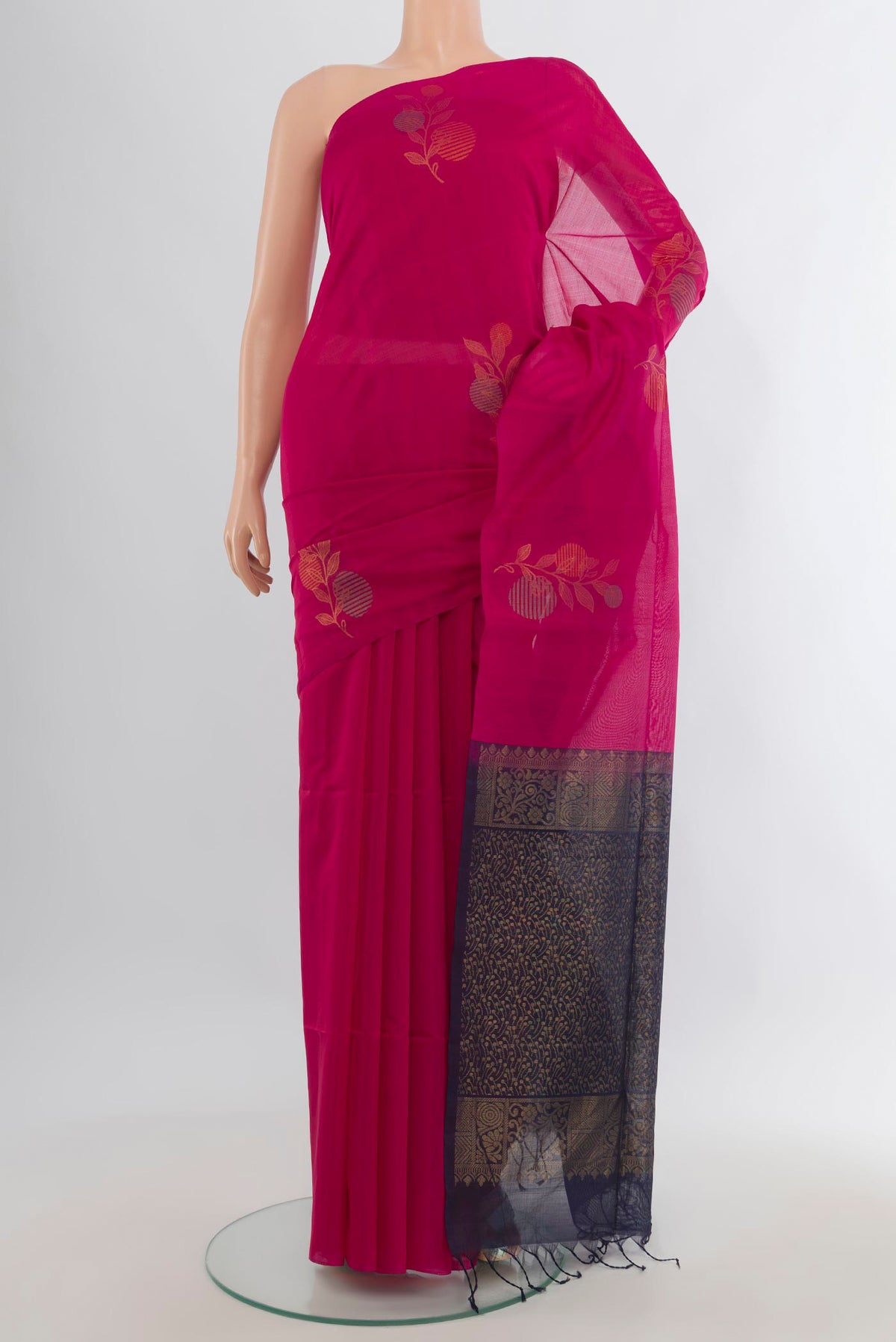 Dark Pink Silk Cotton Saree with Zari Butta on the body and Without Border.  displayed on a mannequin