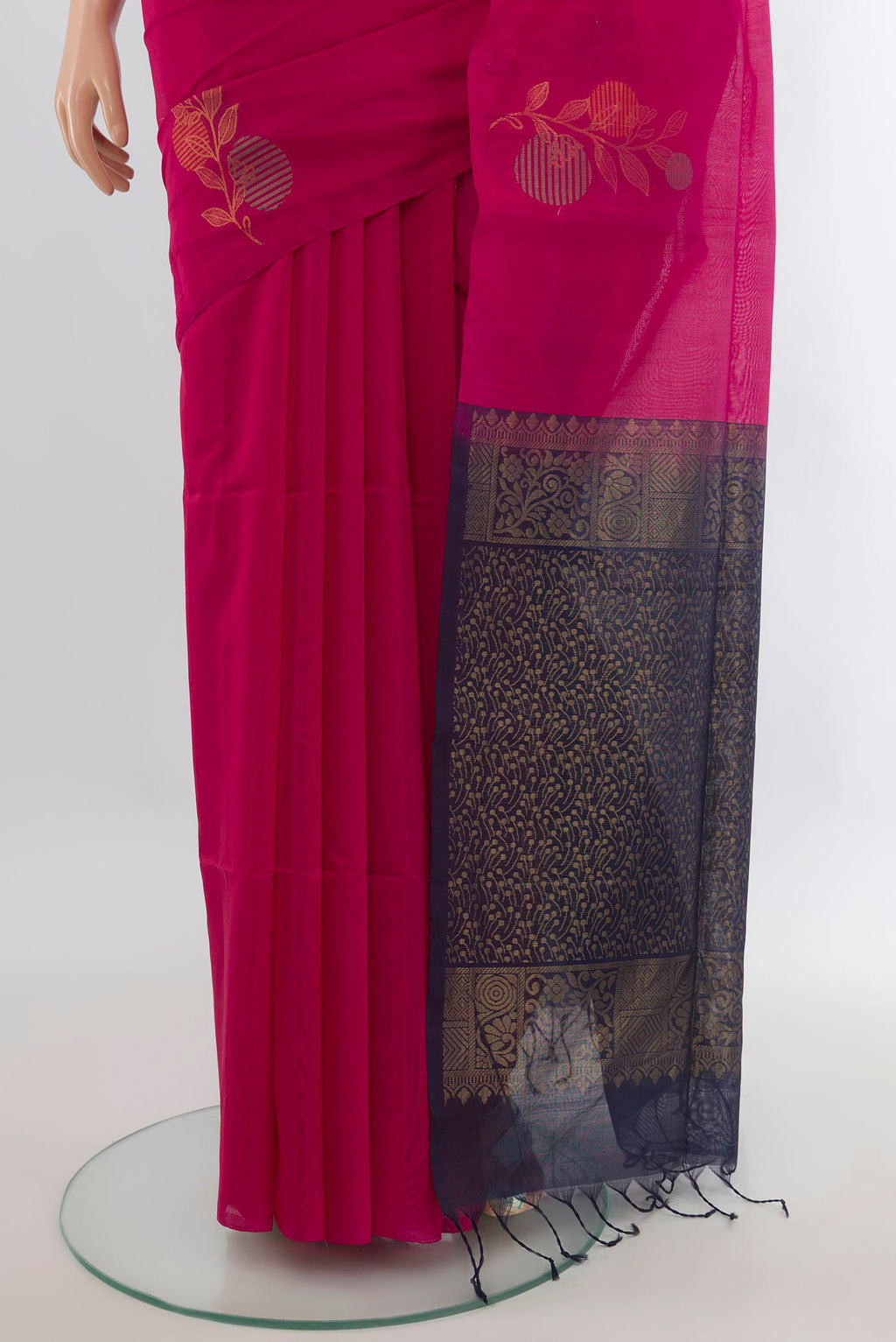 Pleats and pallu of Dark Pink Silk Cotton Saree with Zari Butta on the body and Without Border. 