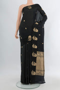 Black Banarasi Katan Silk Saree with Zari Butta on the body and Fancy Border.  displayed on a mannequin