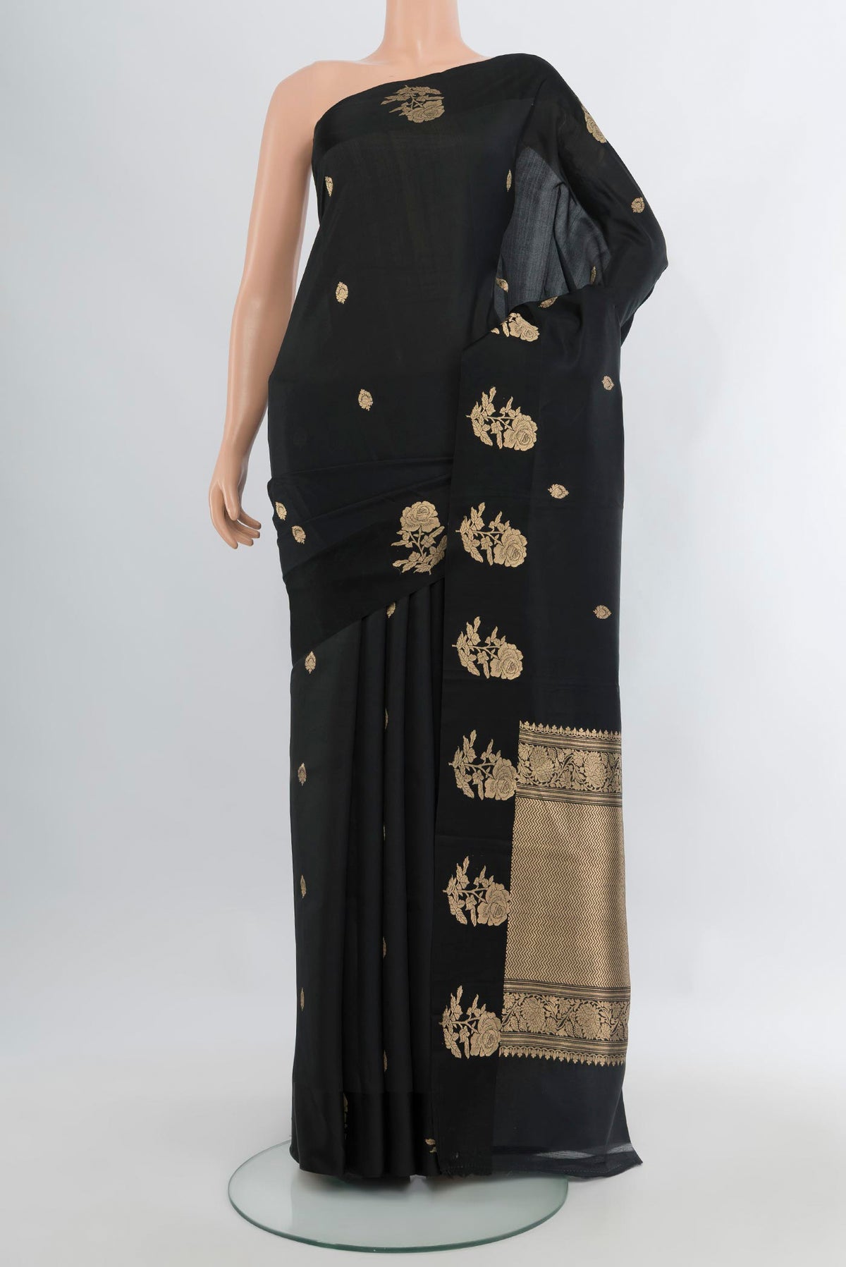 Black Banarasi Katan Silk Saree with Zari Butta on the body and Fancy Border.  displayed on a mannequin