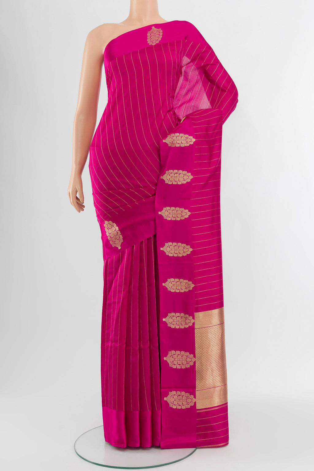 Rani Pink Banarasi Katan Silk Saree with Stripes on the body and Satin Border.  displayed on a mannequin
