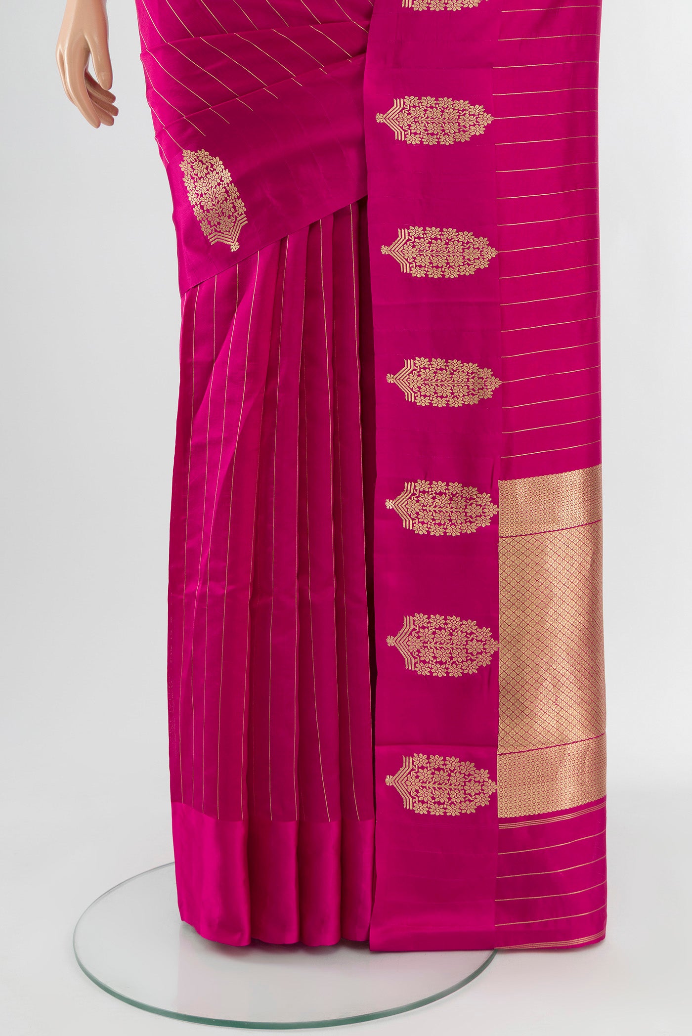 Pleats and pallu of Rani Pink Banarasi Katan Silk Saree with Stripes on the body and Satin Border. 