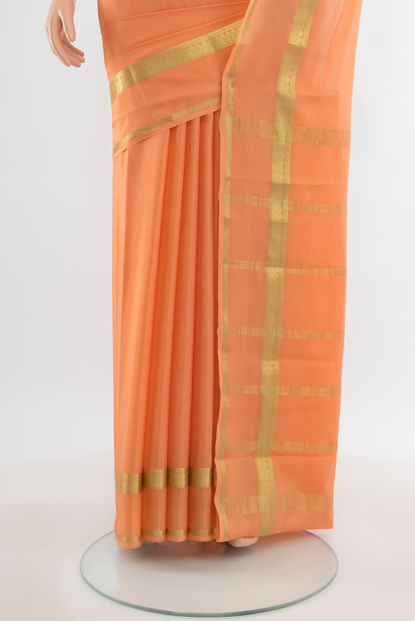 Pleats and pallu of Peach Mysore Crepe Saree with Plain Body and Silk Border. 