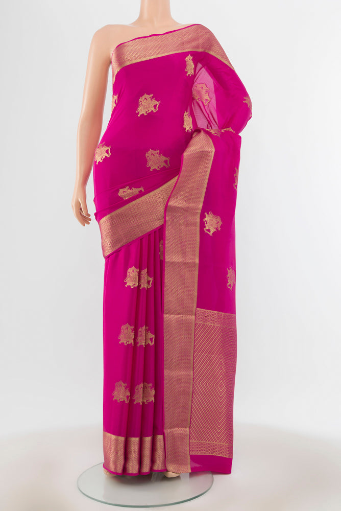 Magenta Mysore Crepe Saree with Plain Body and Silk Border.  displayed on a mannequin