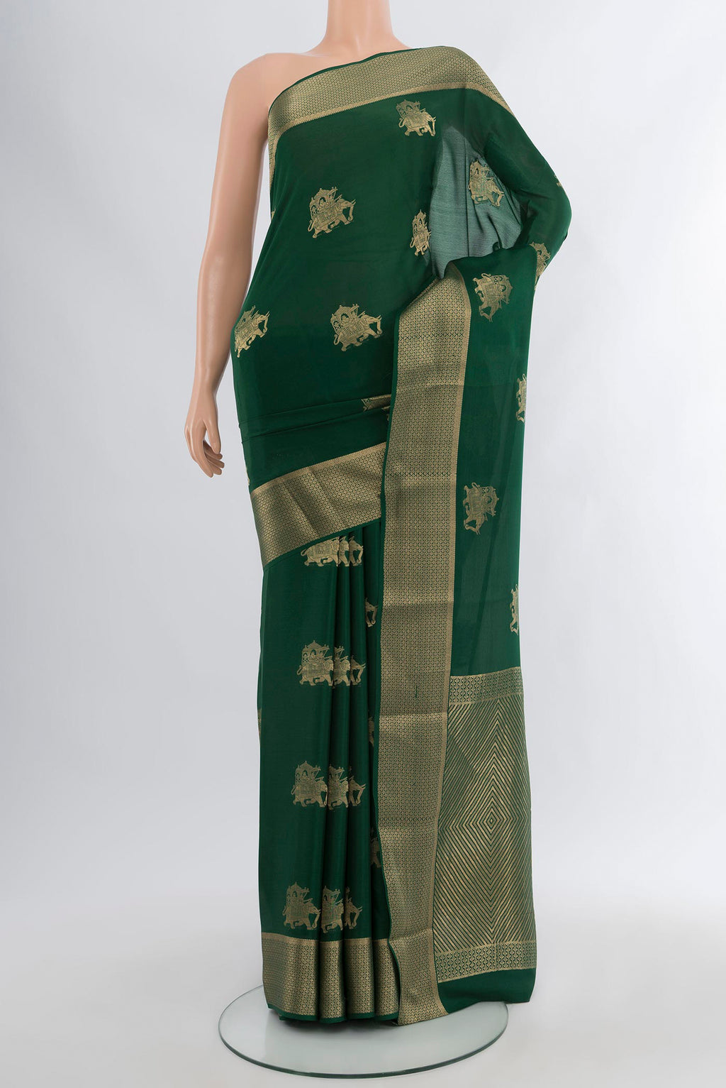 Bottle Green Mysore Crepe Saree with Zari Butta on the body and Zari Border.  displayed on a mannequin