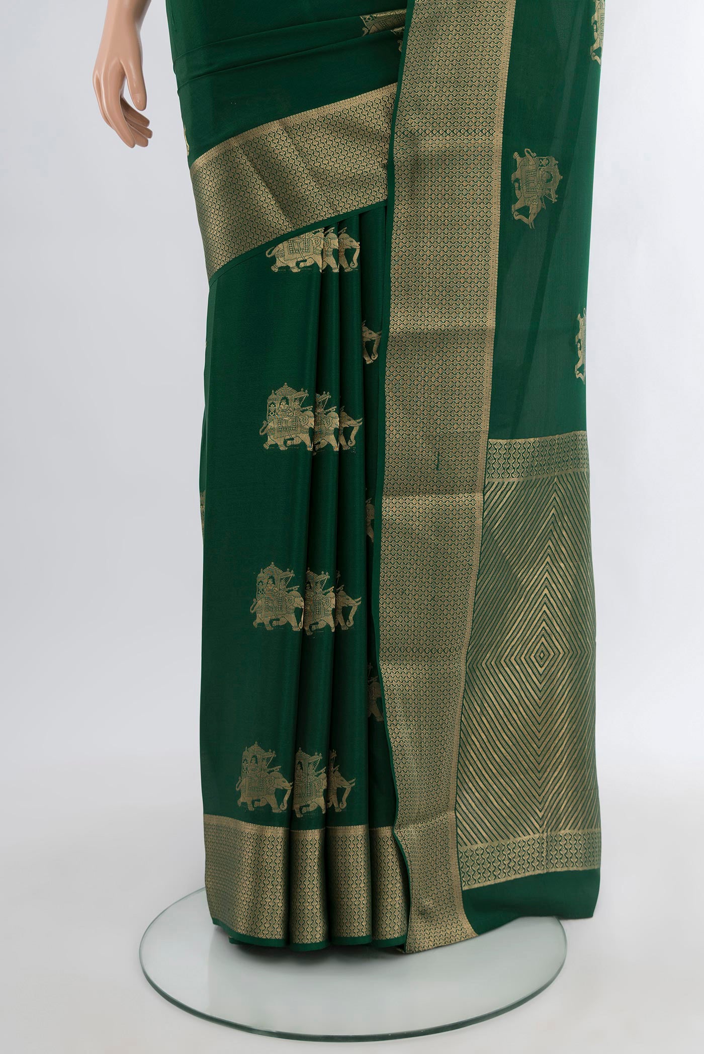 Pleats and pallu of Bottle Green Mysore Crepe Saree with Zari Butta on the body and Zari Border. 