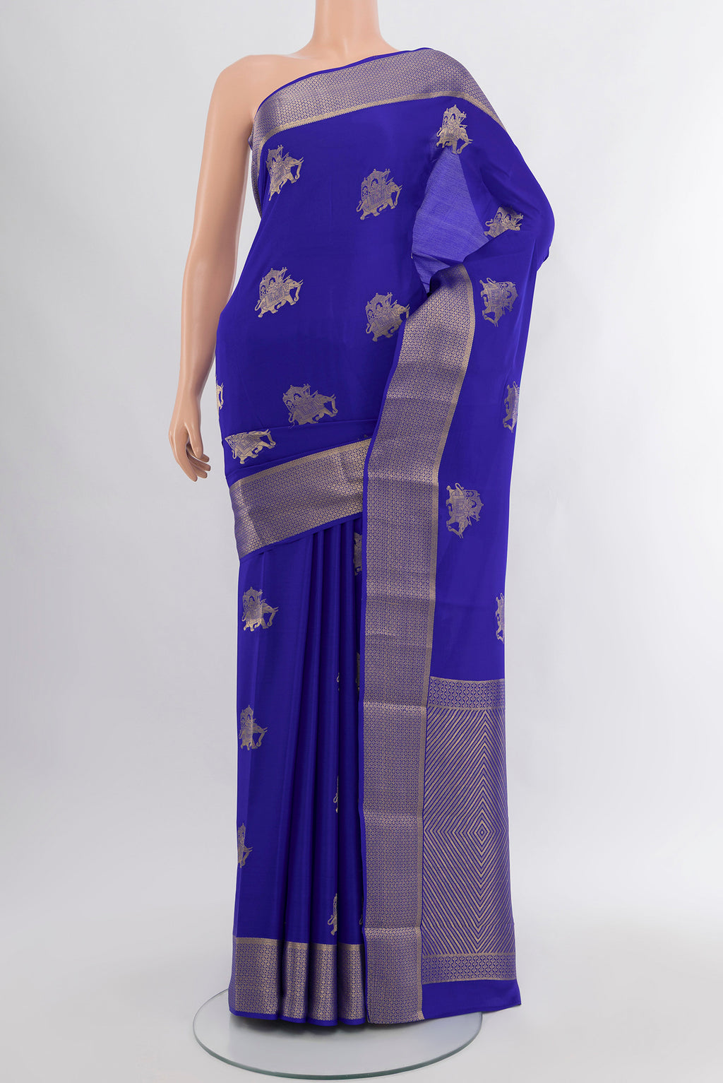 Royal Blue Mysore Crepe Saree with Zari Butta on the body and Zari Border.  displayed on a mannequin