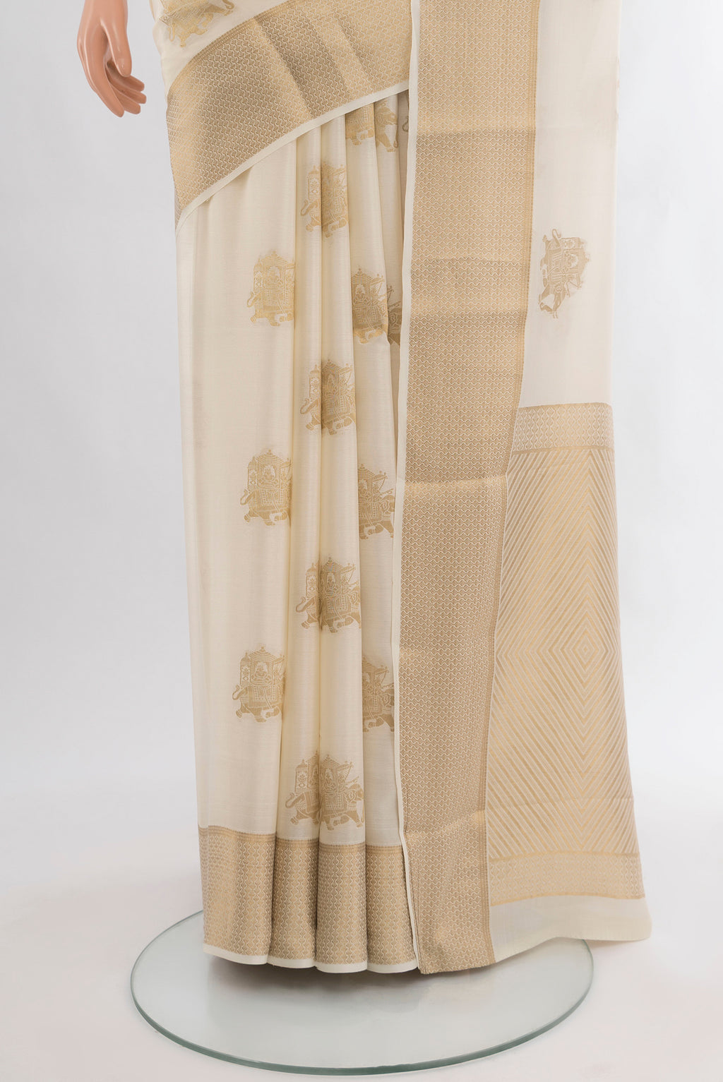 Pleats and pallu of Off White Mysore Crepe Saree with Zari Butta on the body and Zari Border. 