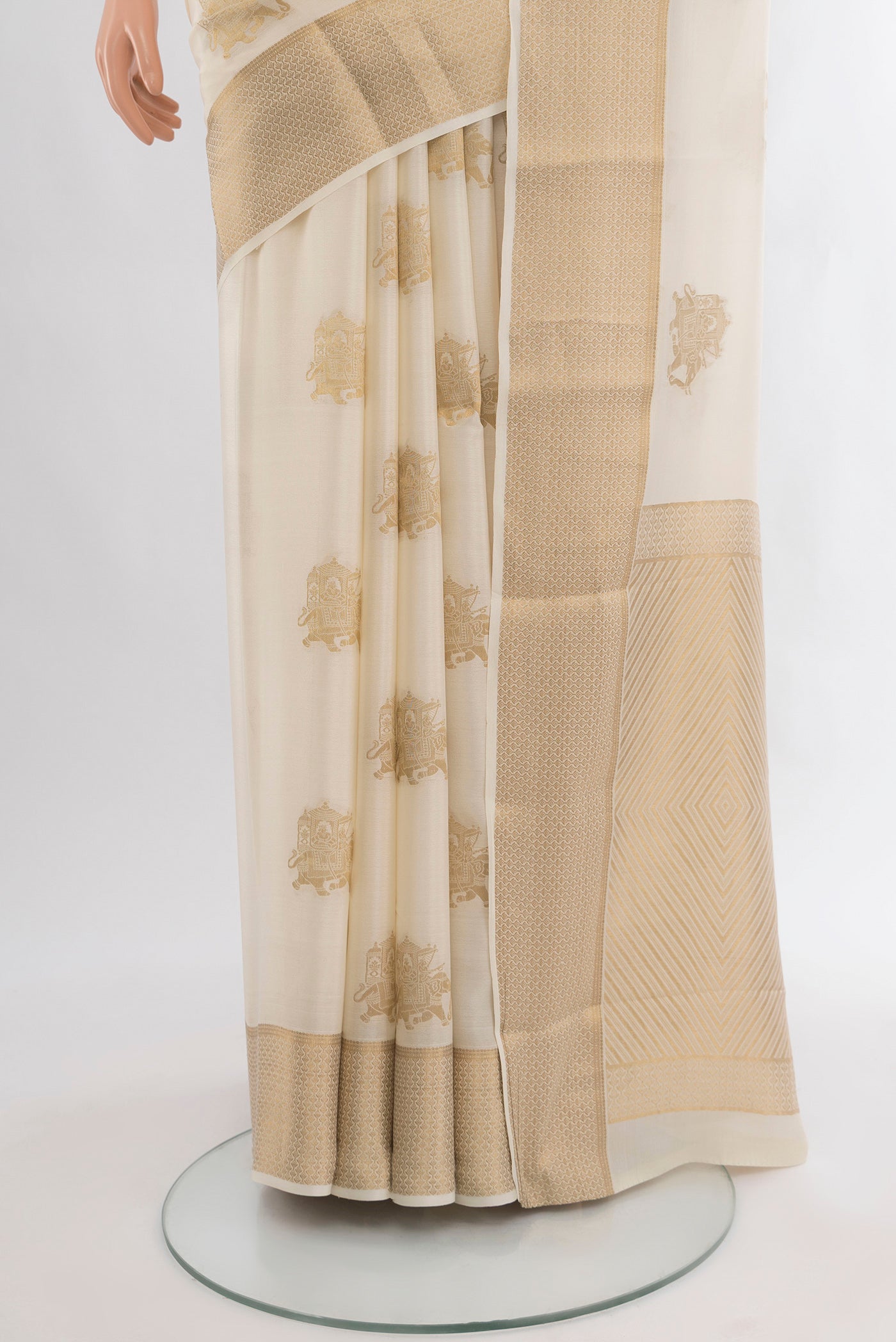 Pleats and pallu of Off White Mysore Crepe Saree with Zari Butta on the body and Zari Border. 