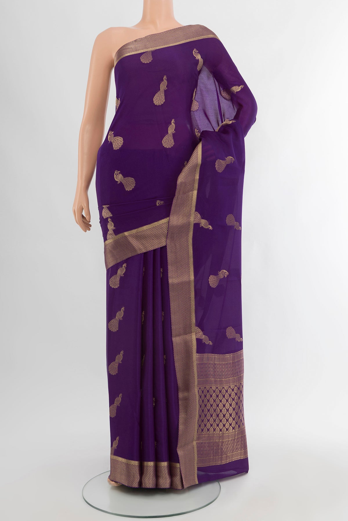 Violet Mysore Crepe Saree with Zari Butta on the body and Zari Border.  displayed on a mannequin
