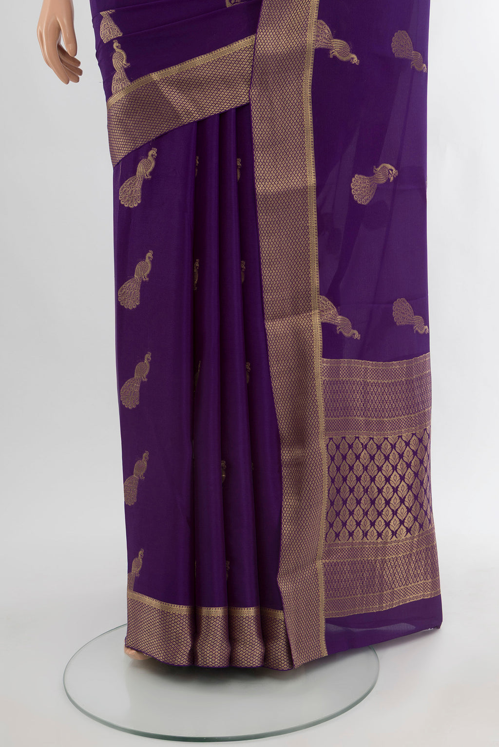 Pleats and pallu of Violet Mysore Crepe Saree with Zari Butta on the body and Zari Border. 