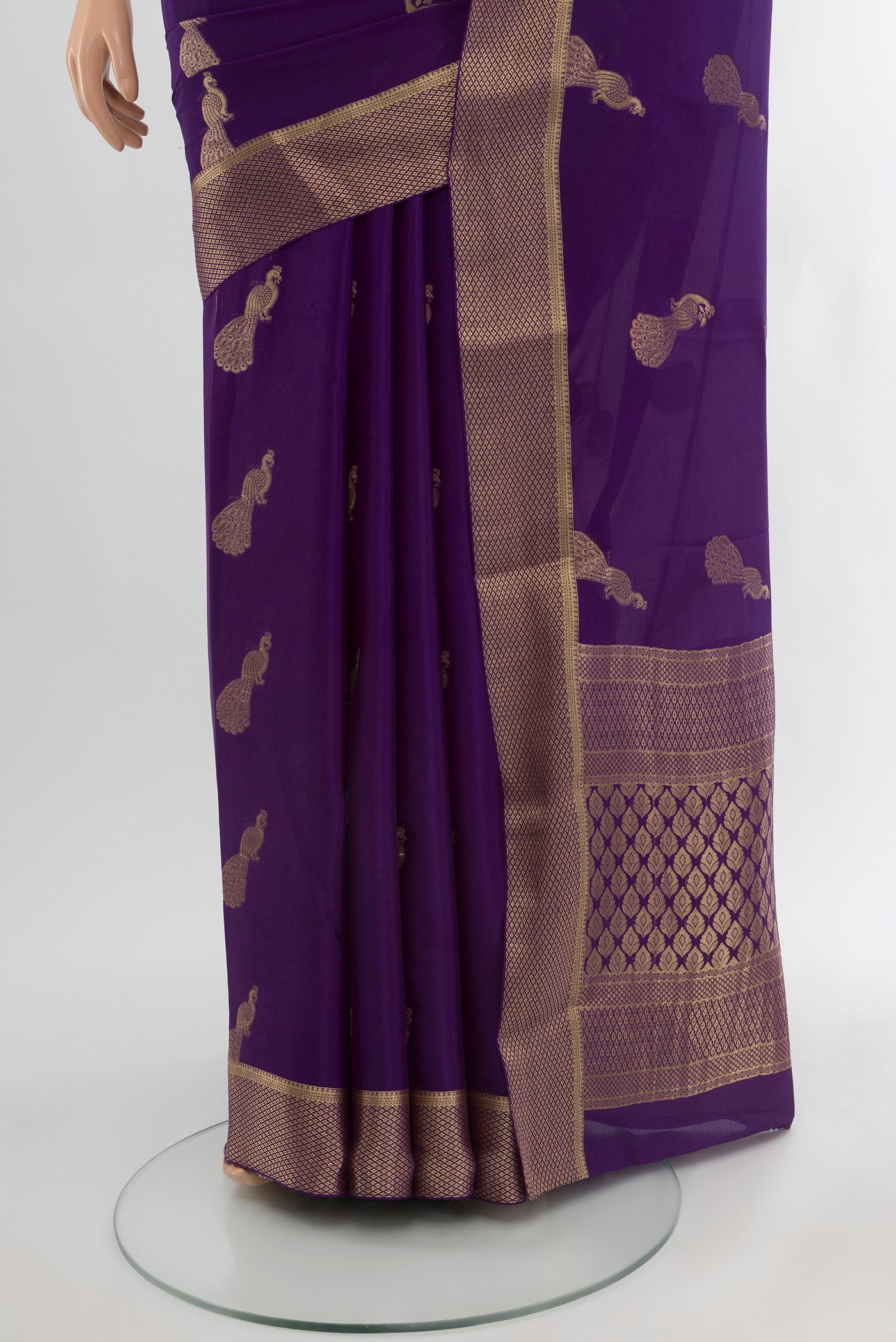 Pleats and pallu of Violet Mysore Crepe Saree with Zari Butta on the body and Zari Border. 