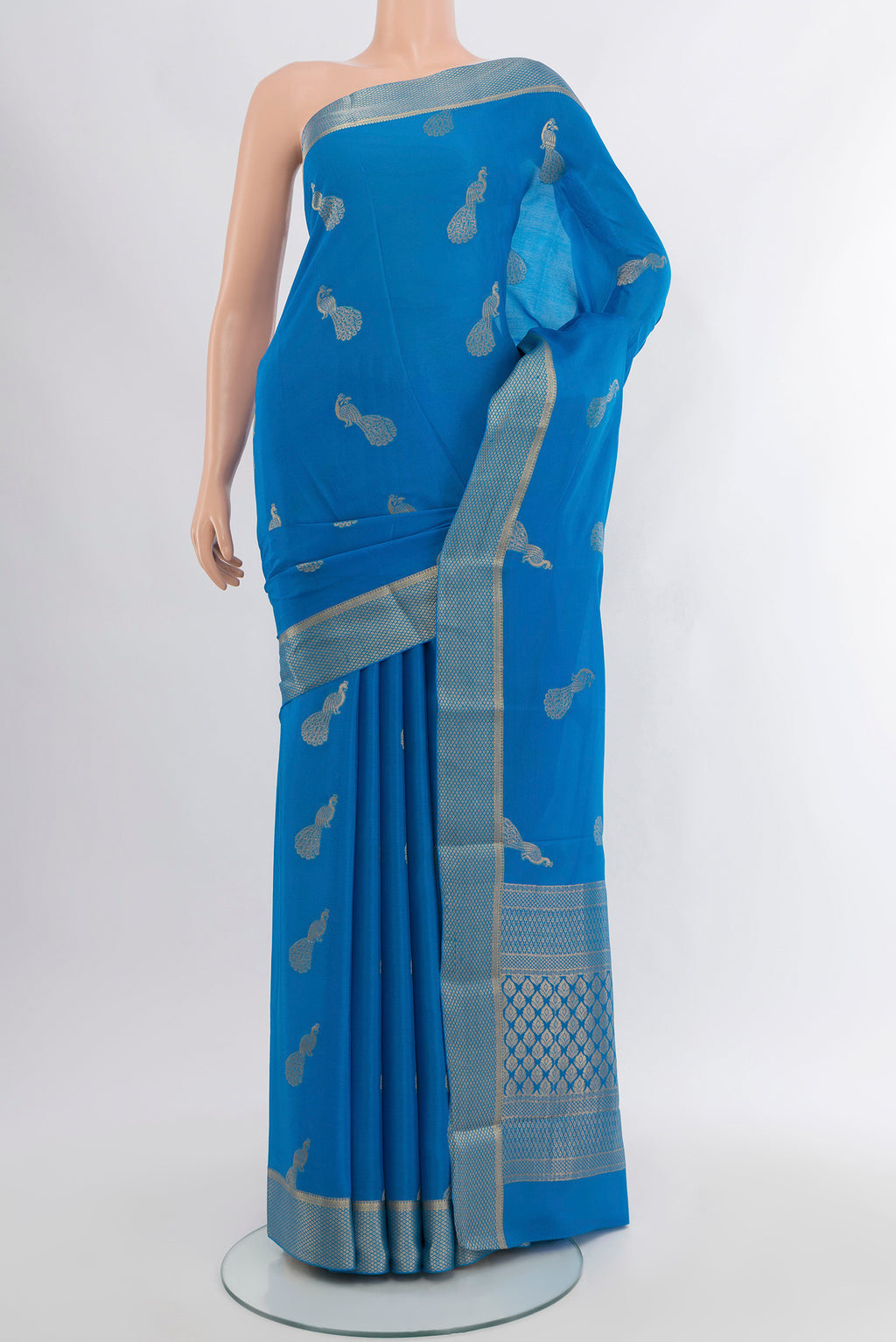 Light Blue Mysore Crepe Saree with Zari Butta on the body and Zari Border.  displayed on a mannequin