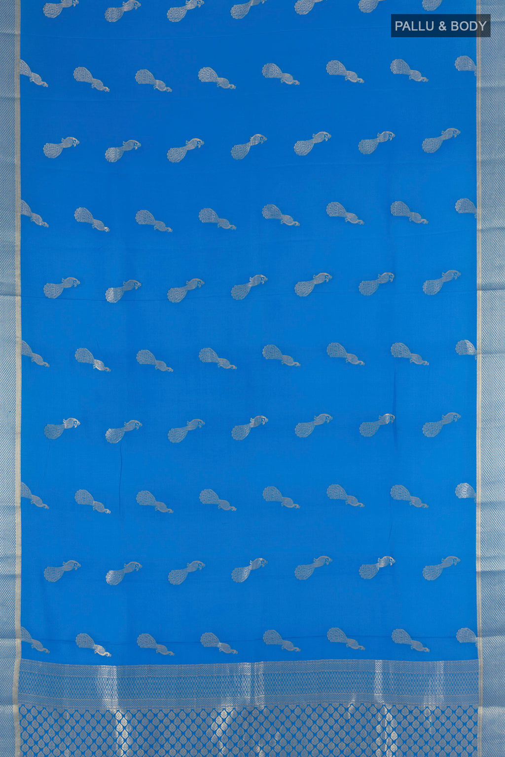 Flat view of Light Blue Mysore Crepe Saree with Zari Butta on the body and Zari Border. 