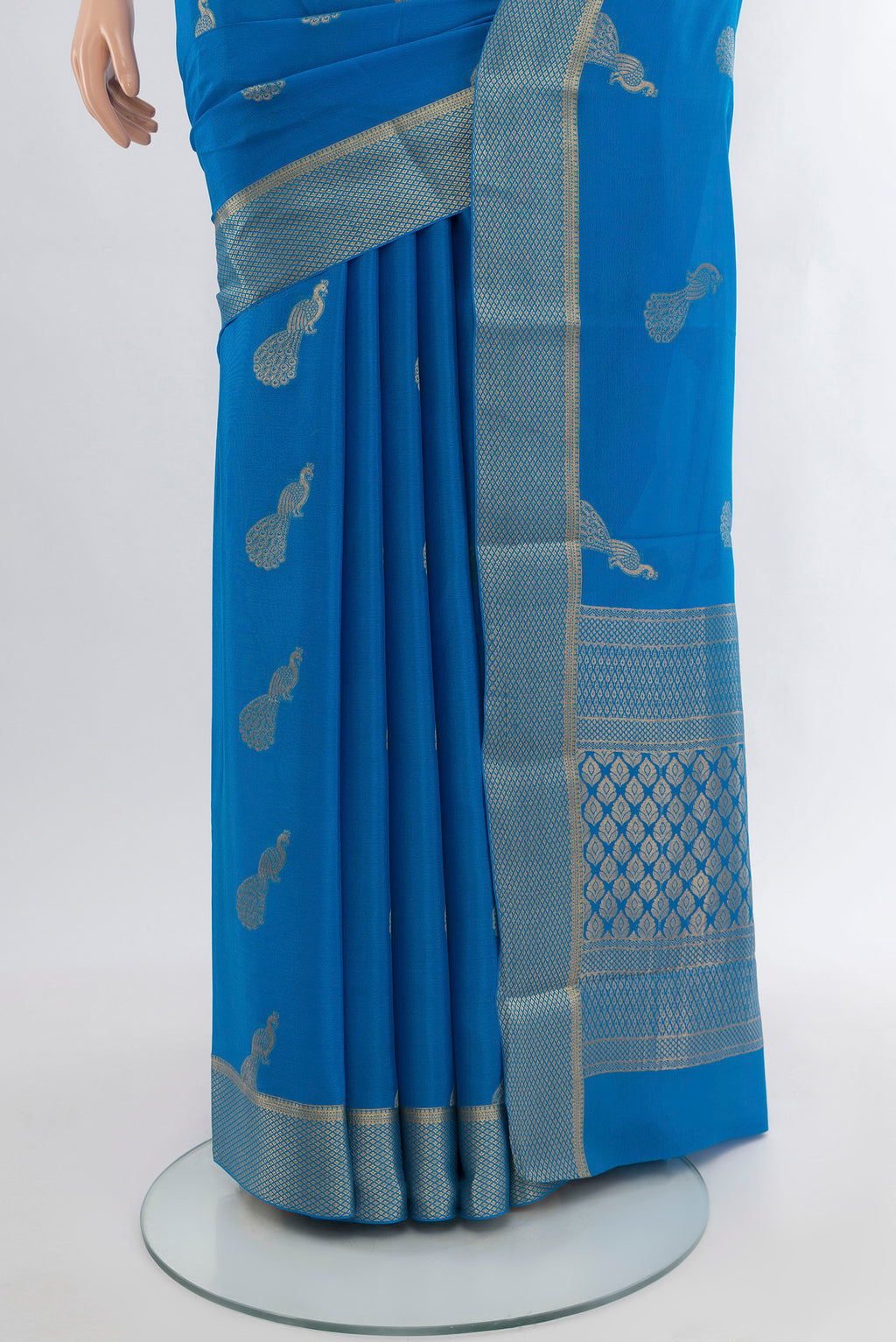 Pleats and pallu of Light Blue Mysore Crepe Saree with Zari Butta on the body and Zari Border. 