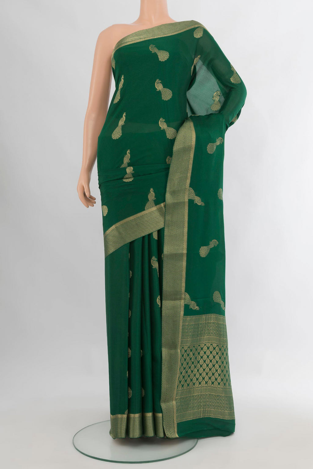 Bottle Green Mysore Crepe Saree with Zari Butta on the body and Zari Border.  displayed on a mannequin