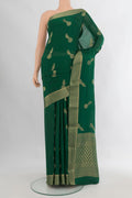Bottle Green Mysore Crepe Saree with Zari Butta on the body and Zari Border.  displayed on a mannequin
