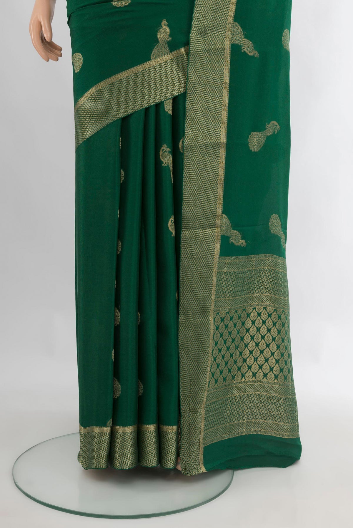 Pleats and pallu of Bottle Green Mysore Crepe Saree with Zari Butta on the body and Zari Border. 