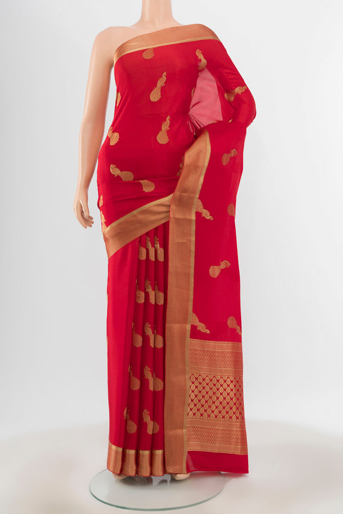 Pure Silk Pure Zari Red Mysore Crepe Saree with Zari Butta on the body and Silk Border.  displayed on a mannequin