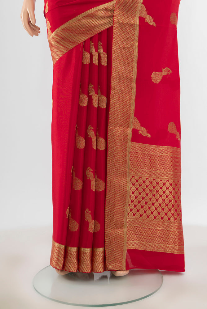 Pleats and pallu of Pure Silk Pure Zari Red Mysore Crepe Saree with Zari Butta on the body and Silk Border. 