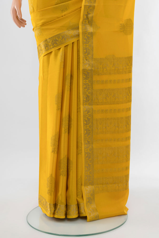 Pleats and pallu of Yellow Mysore Crepe Saree with Zari Butta on the body and Silk Border. 