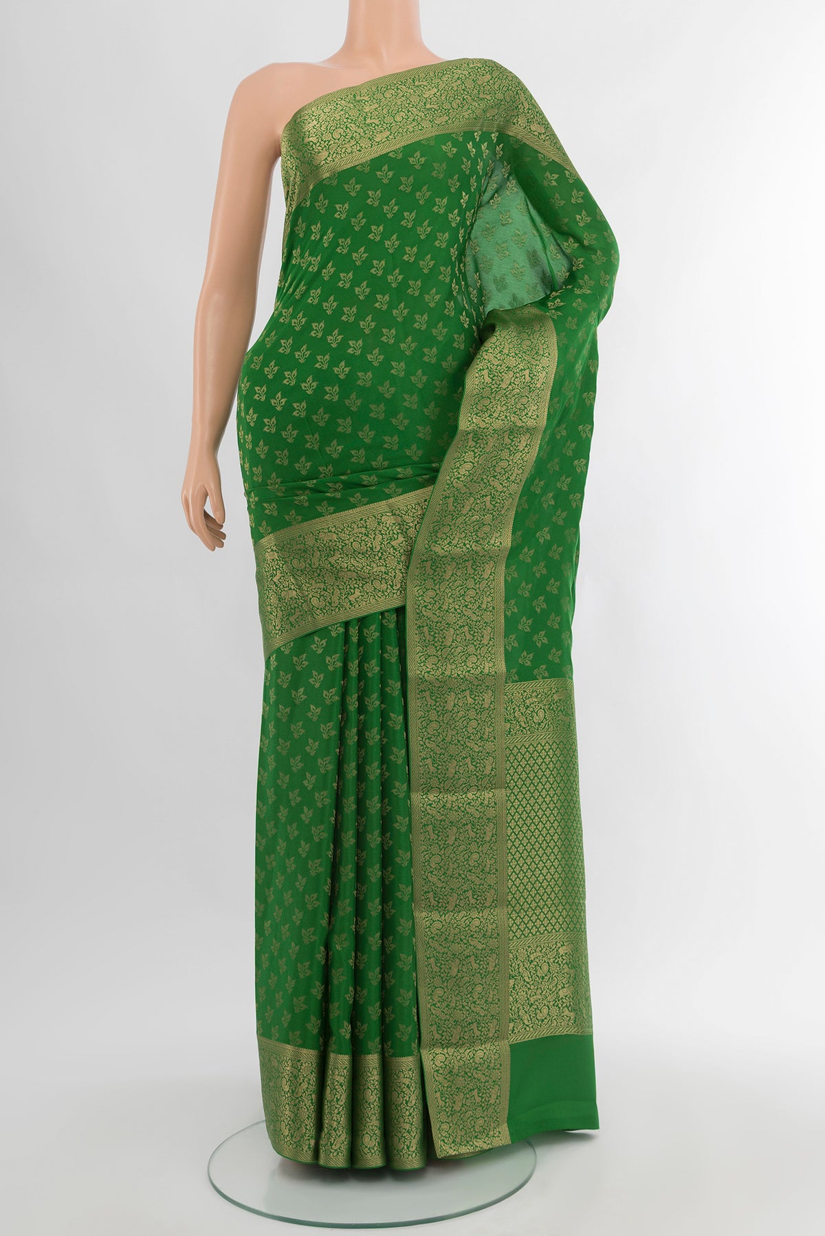 Green Mysore Crepe Saree with Zari Butta on the body and Zari Border.  displayed on a mannequin