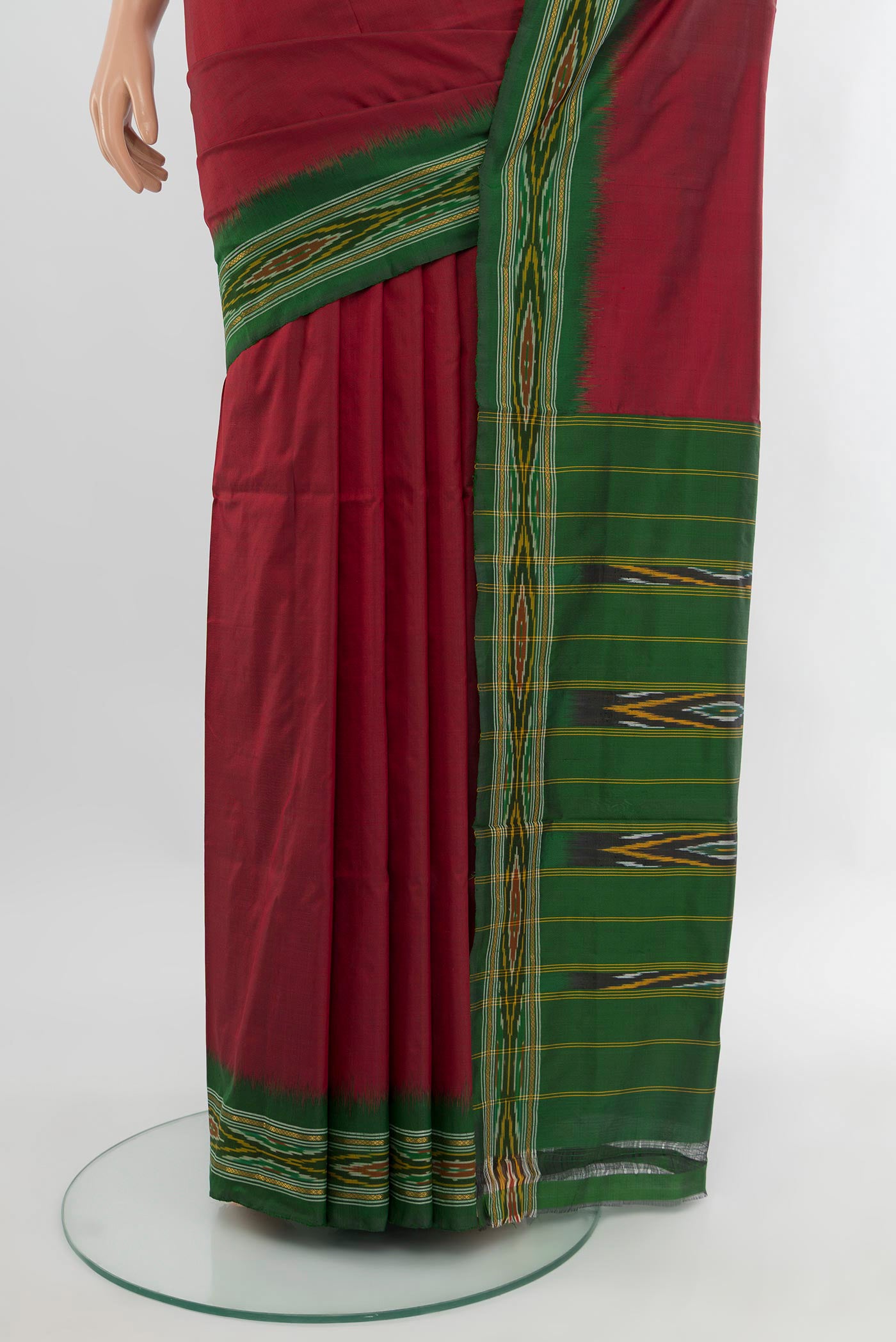 Pleats and pallu of Maroon Pochampally Silk Saree with Plain Body and Ikat Border. 