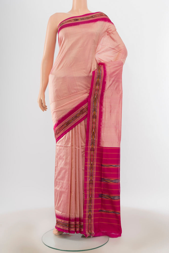 Peach Pochampally Saree with Ikat Print on the body and Silk Border.  displayed on a mannequin