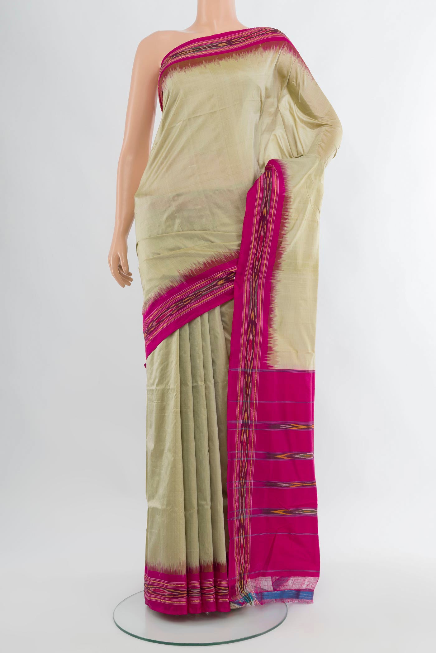 Beige Pochampally Silk Saree with Plain Body and Ikat Border.  displayed on a mannequin