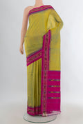 Pure Silk Acid Green Pochampally Saree with Plain Body and Ikat Border.  displayed on a mannequin