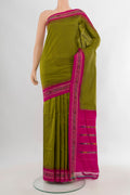 Pure Silk Mehandi Green Pochampally Saree with Plain Body and Ikat Border.  displayed on a mannequin