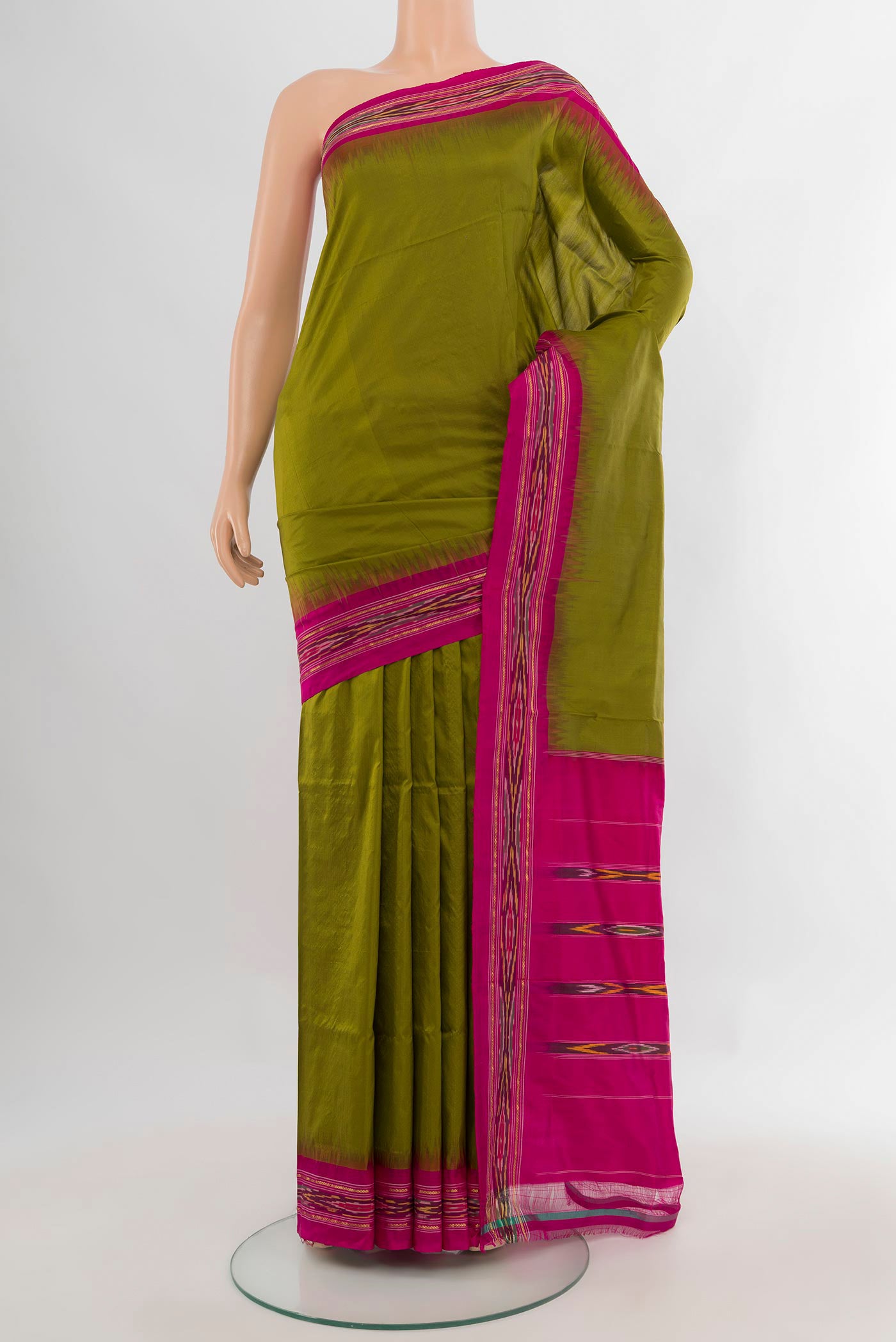 Pure Silk Mehandi Green Pochampally Saree with Plain Body and Ikat Border.  displayed on a mannequin