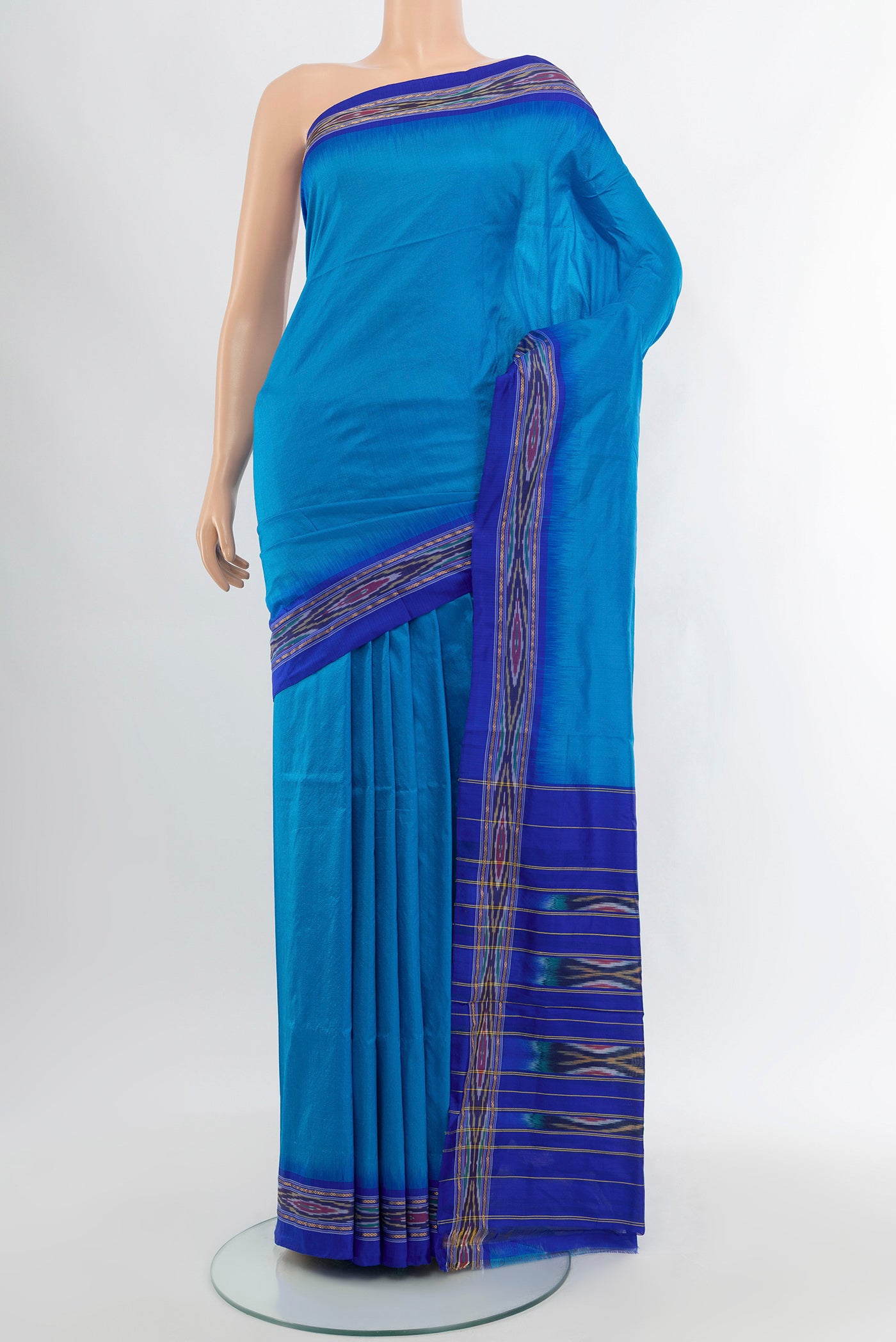 Royal Blue Pochampally Silk Saree with Plain Body and Ikat Border.  displayed on a mannequin