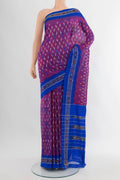 Purple Pochampally Silk Saree with Ikat design on the body and Ikat Border.  displayed on a mannequin
